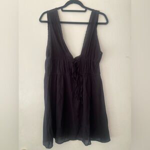 Black dress swim suit covering.